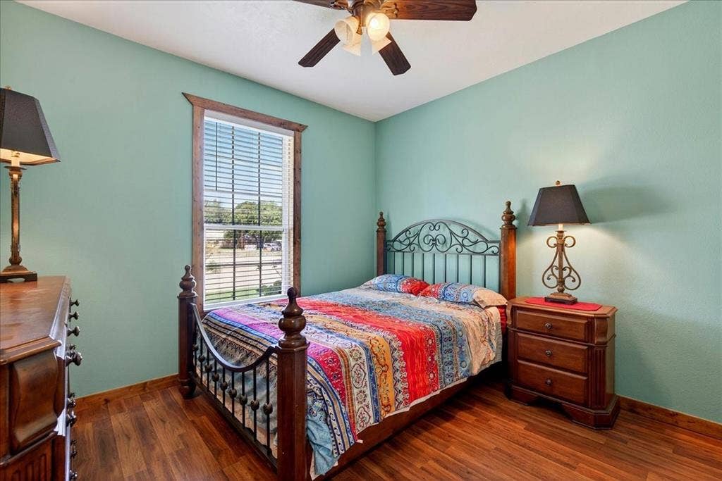 11591 Farm Market 59, Athens, TX 75751 4th bedroom on Level 1 with Wood-finish flooring, ceiling fan and closet, window view.