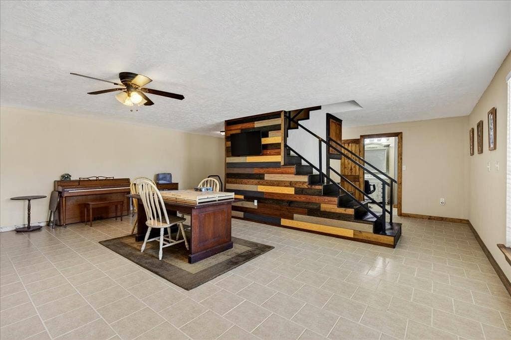 11591 Farm Market 59, Athens, TX 75751 Basement 1565SF Expansive room featuring light-colored square tile flooring. This space as so much potentials - family room, media room, game room, office space, and more. French doors lead outside.