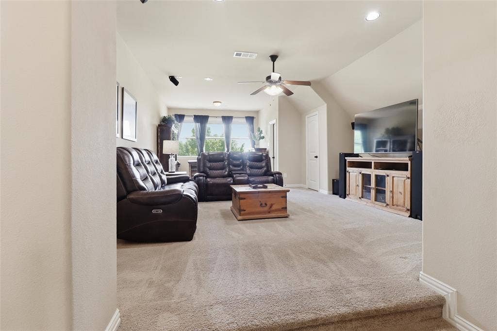 6905 Denali Drive, McKinney, TX 75070 Upstairs Spacious carpeted room featuring a ceiling fan, recessed lighting, and an entertainment console