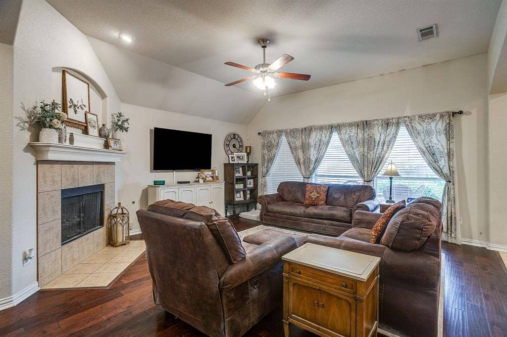 1316 Meadowlakes, Azle, TX 76020 Corner fireplace with tile surround.