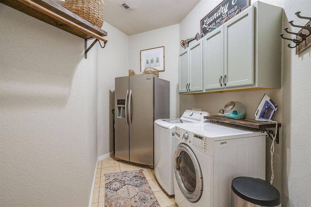 1316 Meadowlakes, Azle, TX 76020 Big laundry room with space for an extra refrigerator and more storage.