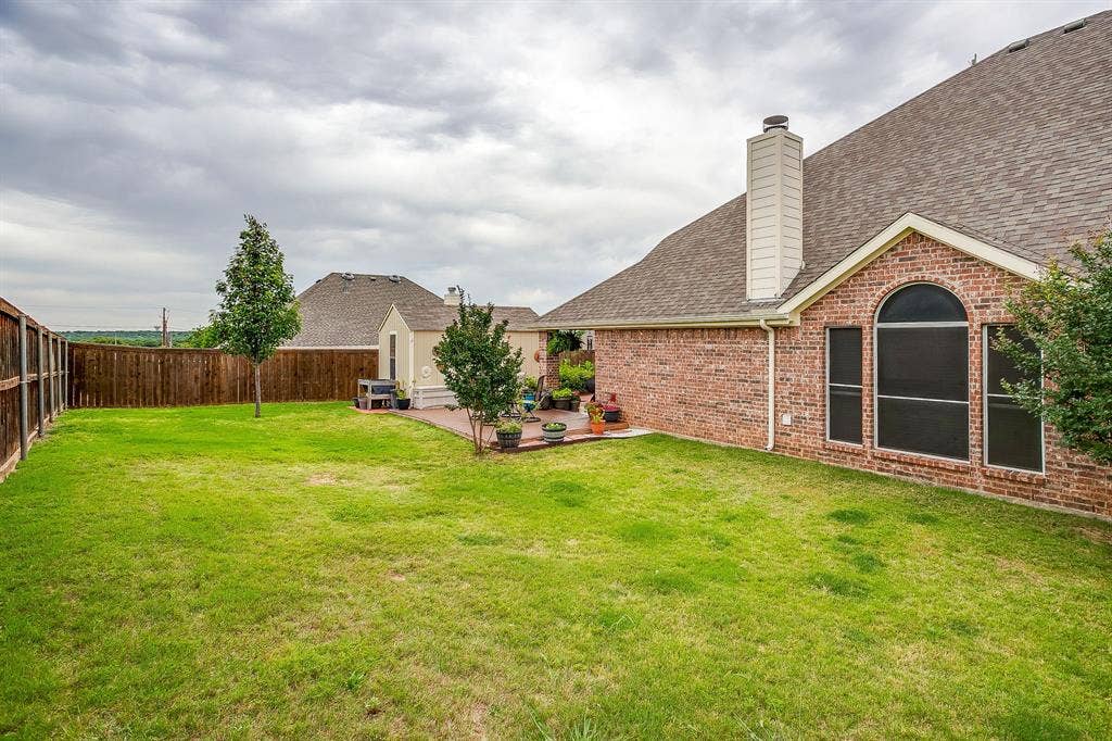 1316 Meadowlakes, Azle, TX 76020 Owner moved fence to accommodate a much larger yard space.