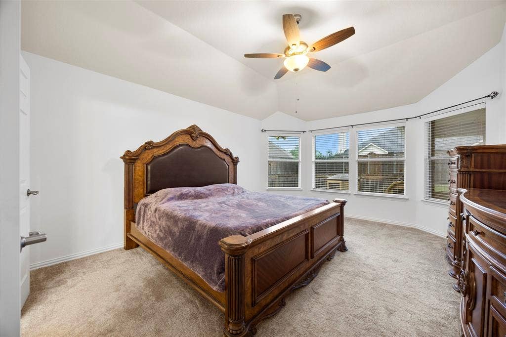 5209 Medallion Court, Midlothian, TX 76065 Primary bedroom on opposite side of the house with large windows overlooking your yard.