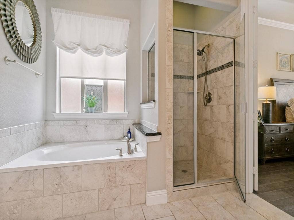 720 Hampshire Drive, Prosper, TX 75078 Primary bathroom has a jetted tub and seperate shower.