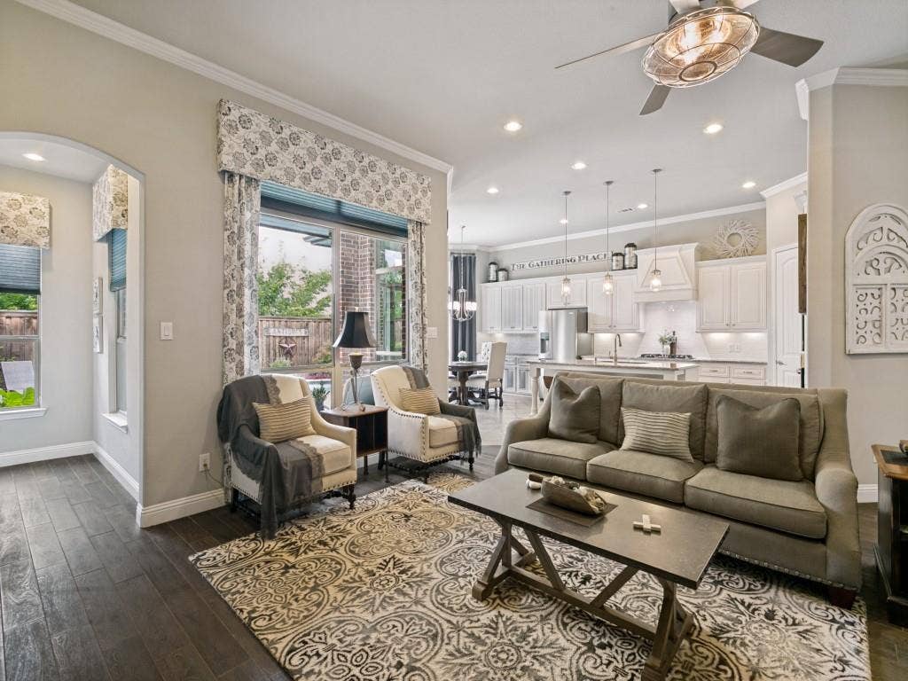 720 Hampshire Drive, Prosper, TX 75078 This living room has lots of natural light and great space for entertaining family or guests.