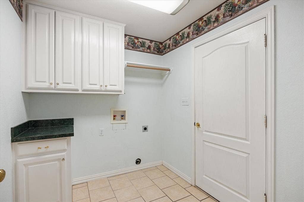 8709 S Monticello Circle, Granbury, TX 76049 Large utlity/laundry room with generous storage and extra closet