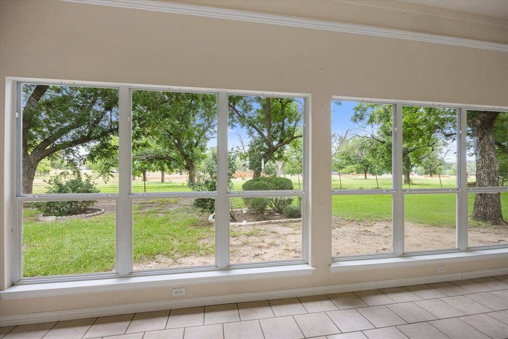 8709 S Monticello Circle, Granbury, TX 76049 Beautiful enclosed patio with floor to ceiling windows-stunning view