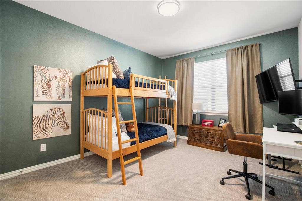 7221 Huckleberry Drive, McKinney, TX 75070 The guest bedroom has plenty of room for kids or guests with another large window.
