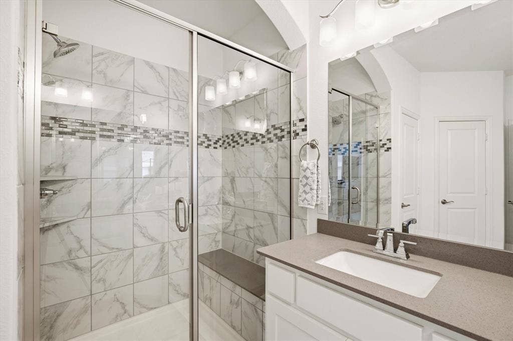 7221 Huckleberry Drive, McKinney, TX 75070 An oversized shower is perfect in this large primary bathroom.