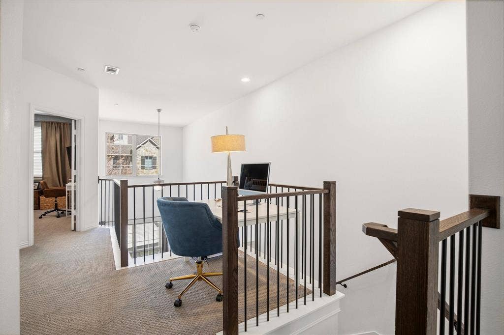 7221 Huckleberry Drive, McKinney, TX 75070 At the top of the stairs, there is a nook that can be utilized for a study or work space.