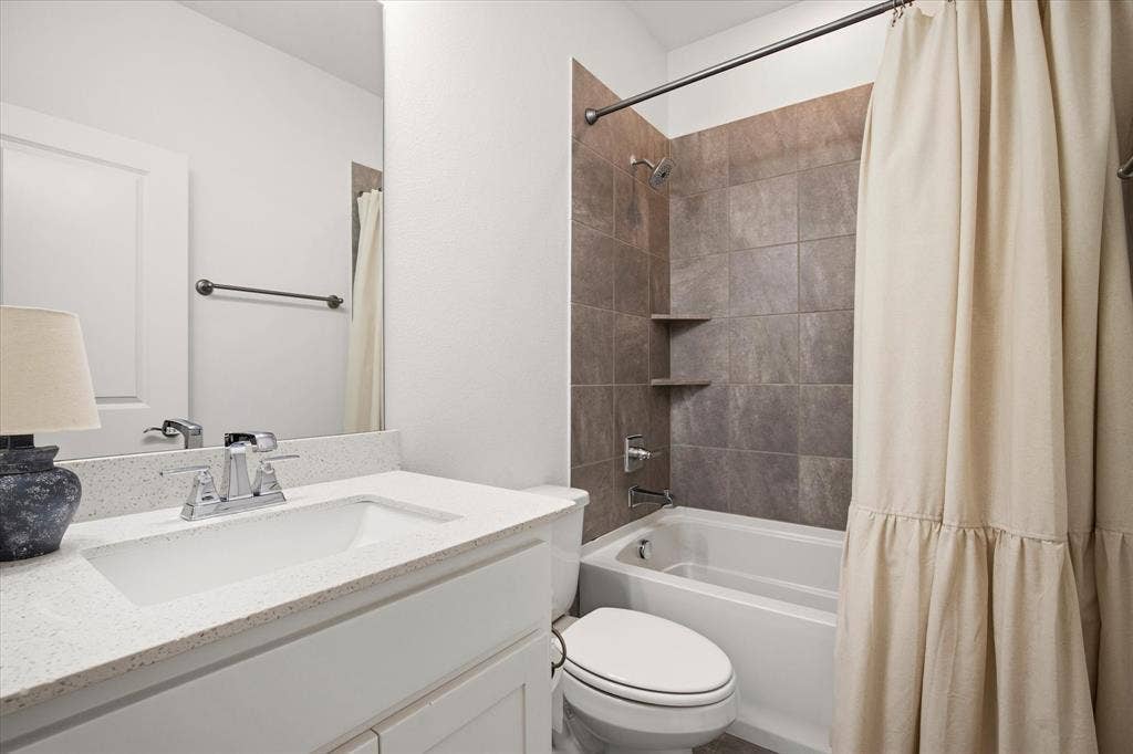 7221 Huckleberry Drive, McKinney, TX 75070 The guest bathroom is just outside the guest bedroom.