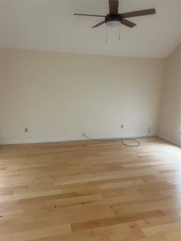 121 Brookside Drive, Duncanville, TX 75137 Hardwood-finish flooring with light-toned walls and a ceiling fan with integrated lighting