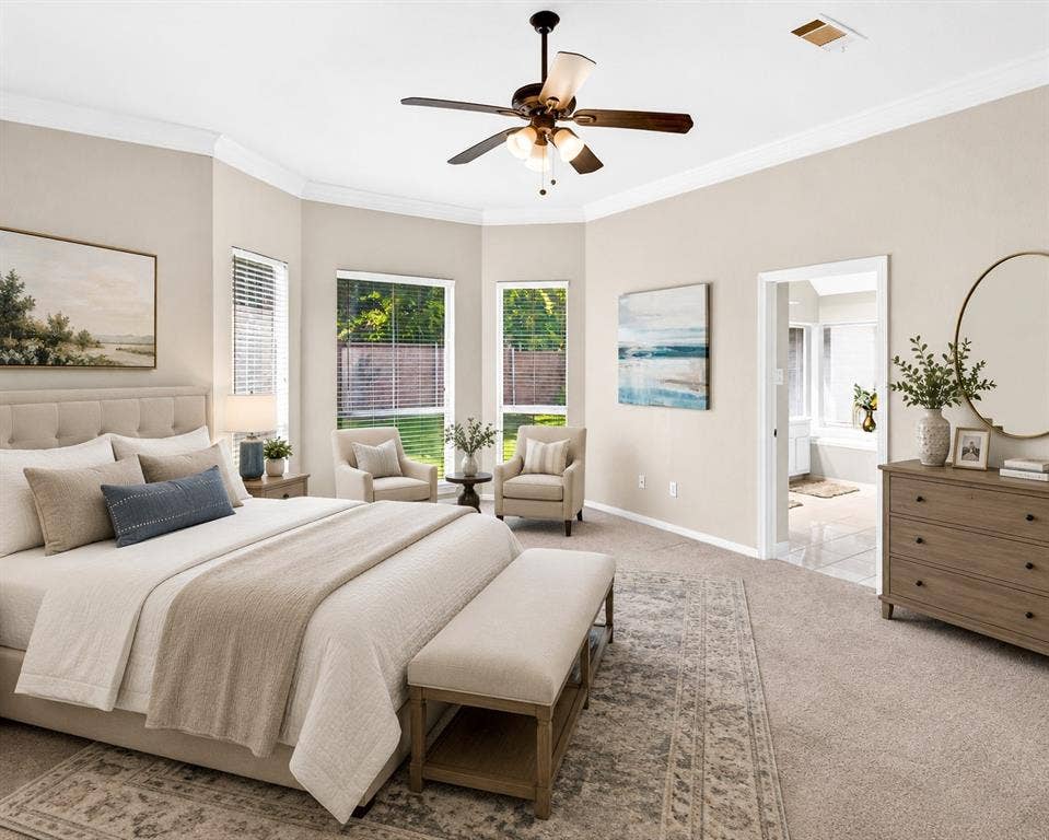6005 Pin Oak Drive, McKinney, TX 75072 Carpeted room featuring a bay window with multiple large windows, crown molding, and a ceiling fan with integrated lighting