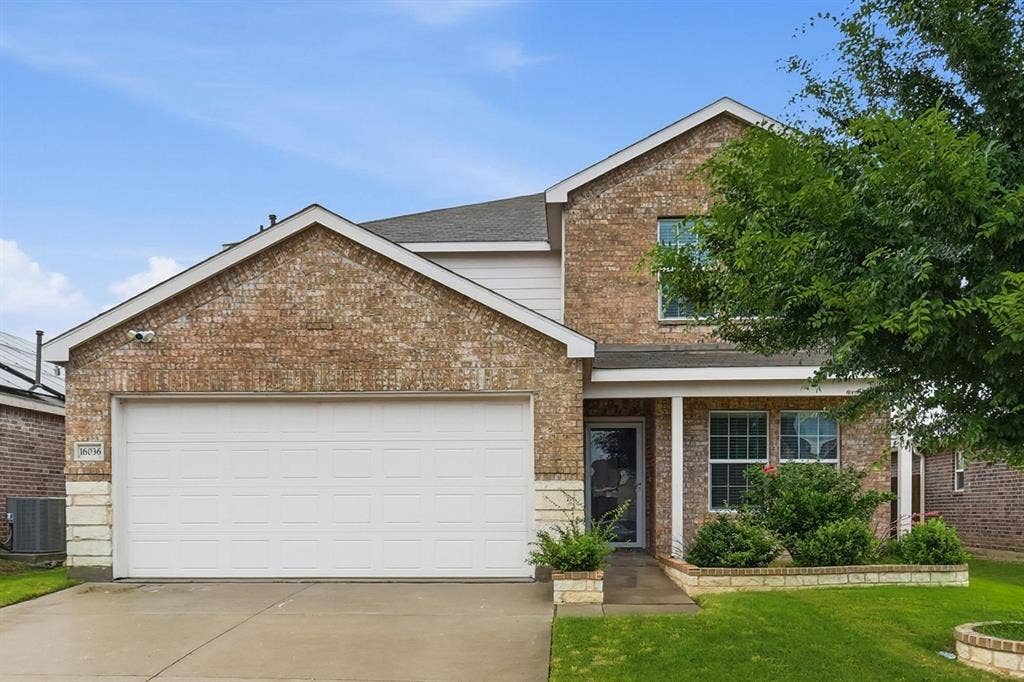 Beautiful brick home with landscaping