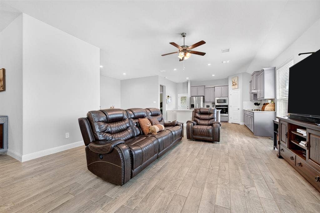 829 Poppie Lane, Midlothian, TX 76065 Open-concept living area featuring wood-finish flooring, recessed lighting, and a ceiling fan