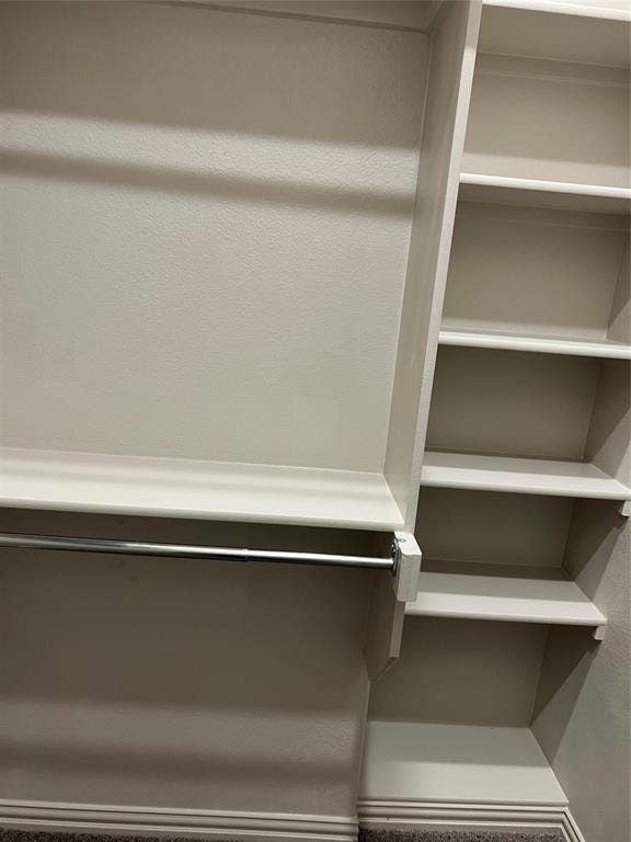 6041 Roper Road, McKinney, TX 75070 Built-in closet organization system featuring shelving and hanging rods