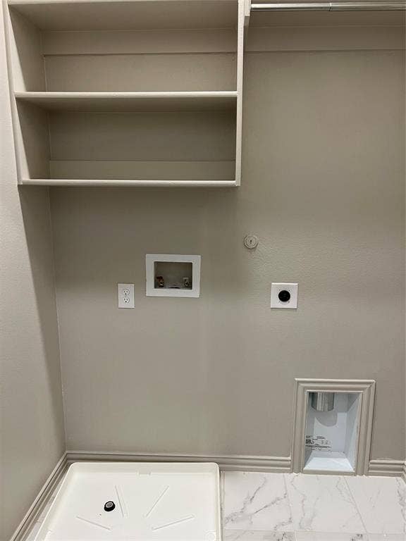 6041 Roper Road, McKinney, TX 75070 Laundry area featuring built-in shelving, a utility sink base, and marble-look flooring