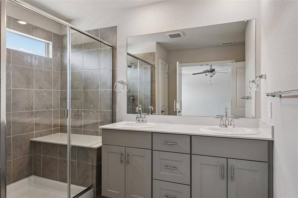 2669 Kings Canyon Mews, Corinth, TX 76210 Primary bath with dual sinks and spacious shower