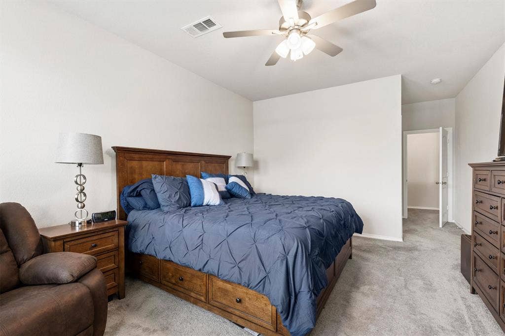 702 Matador Lane, Arlington, TX 76002 Neutral wall colors, vaulted ceiling, and grey carpeting