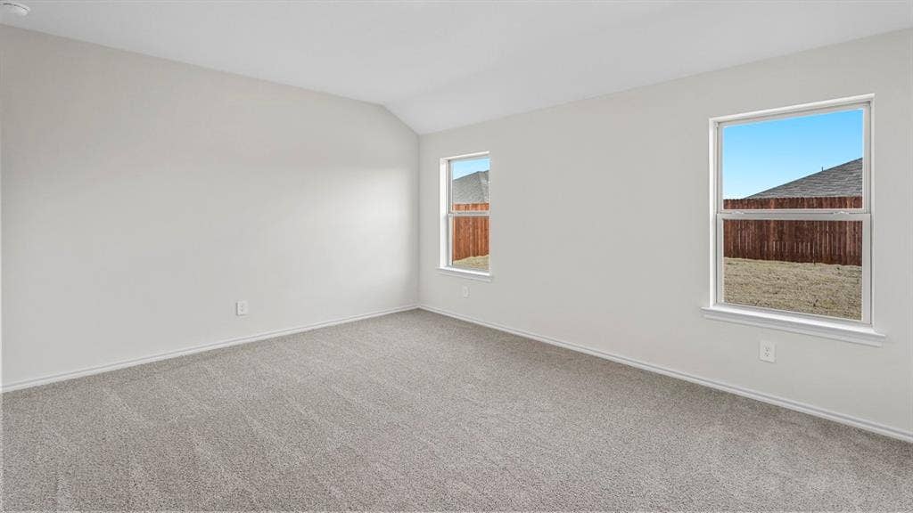 1953 Freeman Street, Tyler, TX 75704 Room featuring neutral-toned carpeting, light-colored walls, and two single-hung windows with white trim