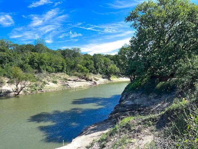 1500 Private Road 8496, Athens, TX 75832 Peaceful river views make this acreage feel worlds away from city noise.