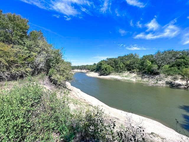 1500 Private Road 8496, Athens, TX 75832 Peaceful Trinity River frontage creates a stunning backdrop for a custom barndominium or family compound.