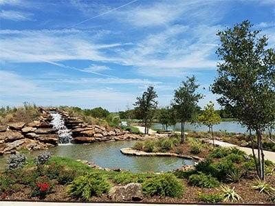 8900 Florance Way, Northlake, TX 76247 Water feature with rock waterfall and surrounding pond