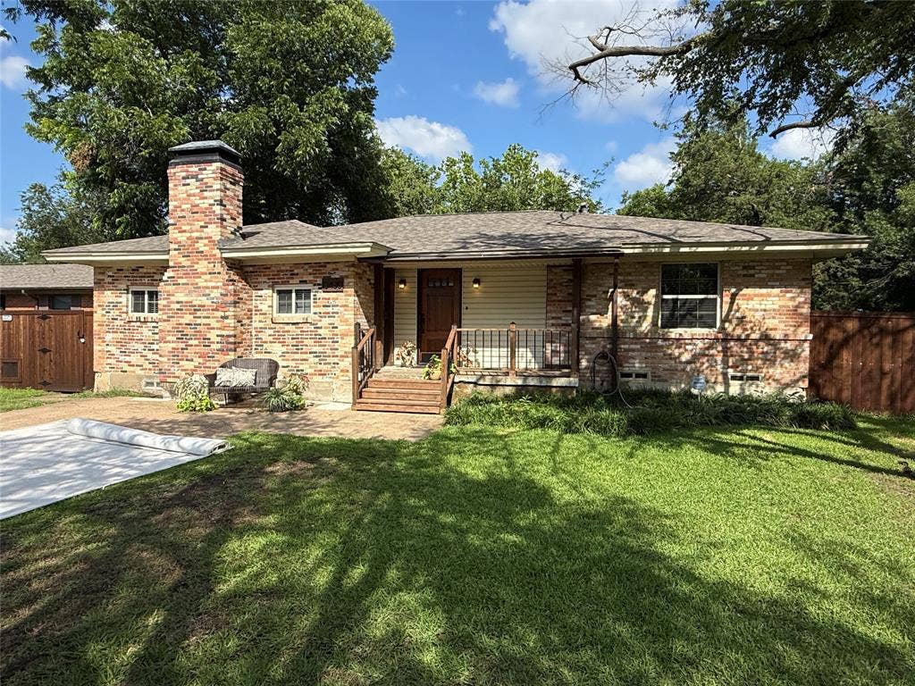 13430 Challaburton Drive, Farmers Branch, TX 75234 Brick exterior with a prominent brick chimney