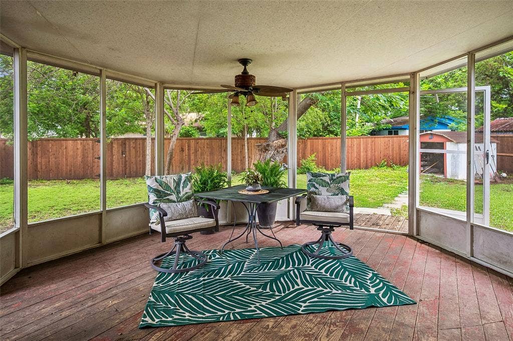 13430 Challaburton Drive, Farmers Branch, TX 75234 Screened outdoor living area featuring wood-finish flooring, a ceiling fan, and direct access to the backyard