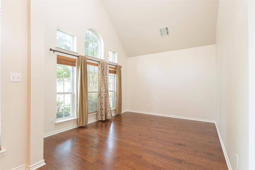 1200 Talley Lane, Frisco, TX 75033 Foyer featuring high vaulted ceiling and dark wood-type flooring