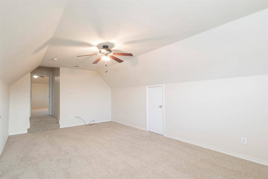 1200 Talley Lane, Frisco, TX 75033 Bonus room featuring ceiling fan, carpet floors, and lofted ceiling