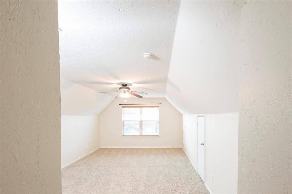 1200 Talley Lane, Frisco, TX 75033 Bonus room with ceiling fan, light colored carpet, and lofted ceiling