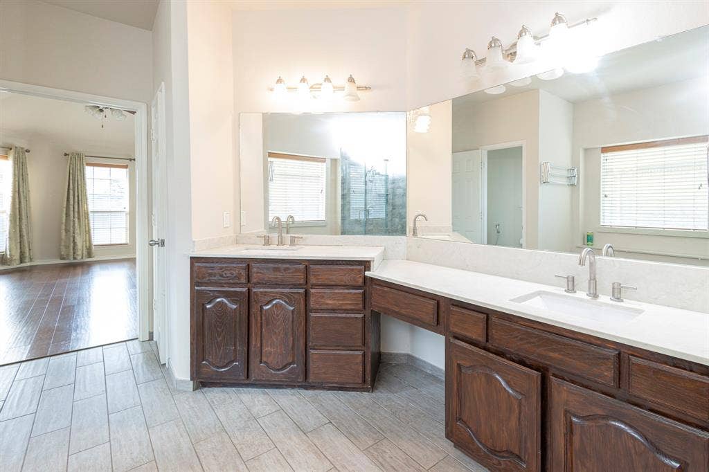 1200 Talley Lane, Frisco, TX 75033 Bathroom featuring dual vanity and wood-type flooring