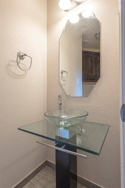 1200 Talley Lane, Frisco, TX 75033 Bathroom with sink and hardwood / wood-style floors