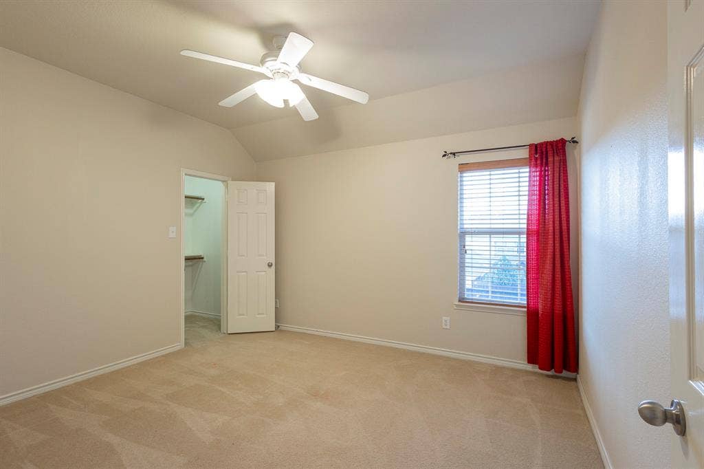 1200 Talley Lane, Frisco, TX 75033 Carpeted empty room featuring ceiling fan and lofted ceiling