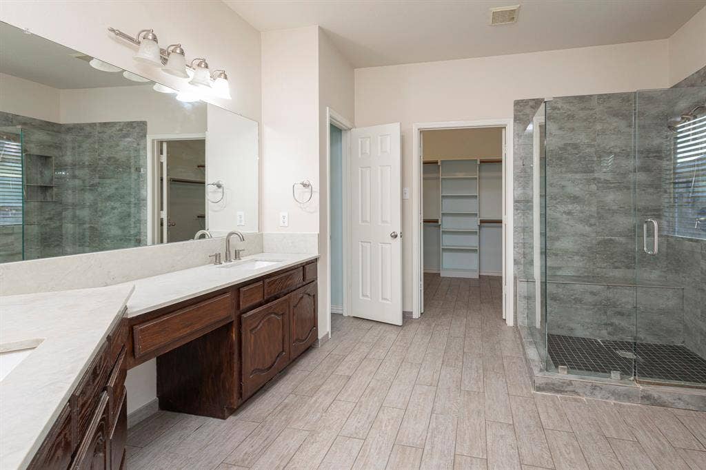 1200 Talley Lane, Frisco, TX 75033 Bathroom with walk in shower and oversized vanity