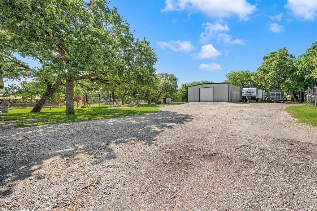 5656 Oak Haven Drive, Fort Worth, TX 76244 This powered shop is a major win for anyone who needs more than a basic garage, with room to work, build, store, or tinker.