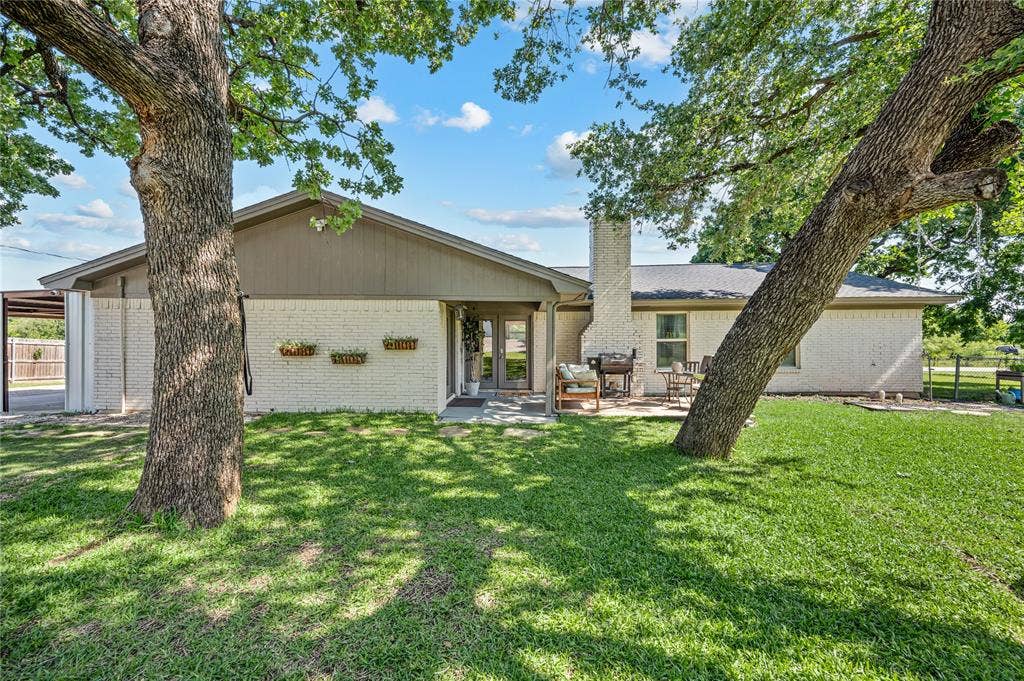 5656 Oak Haven Drive, Fort Worth, TX 76244 This backyard is the showstopper, with mature oak trees, fresh sod, a firepit seating area, and room to play, garden, gather, or just breathe.