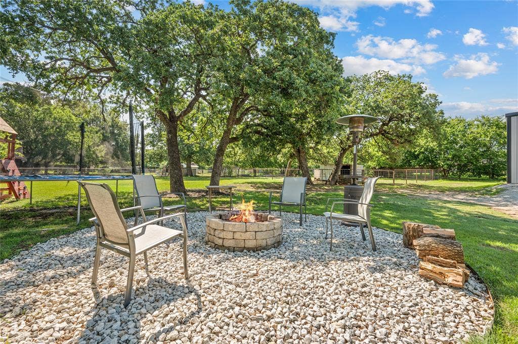 5656 Oak Haven Drive, Fort Worth, TX 76244 Big backyard energy is real here, with space for pets, parties, kids, hammocks, cookouts, and quiet nights by the firepit.