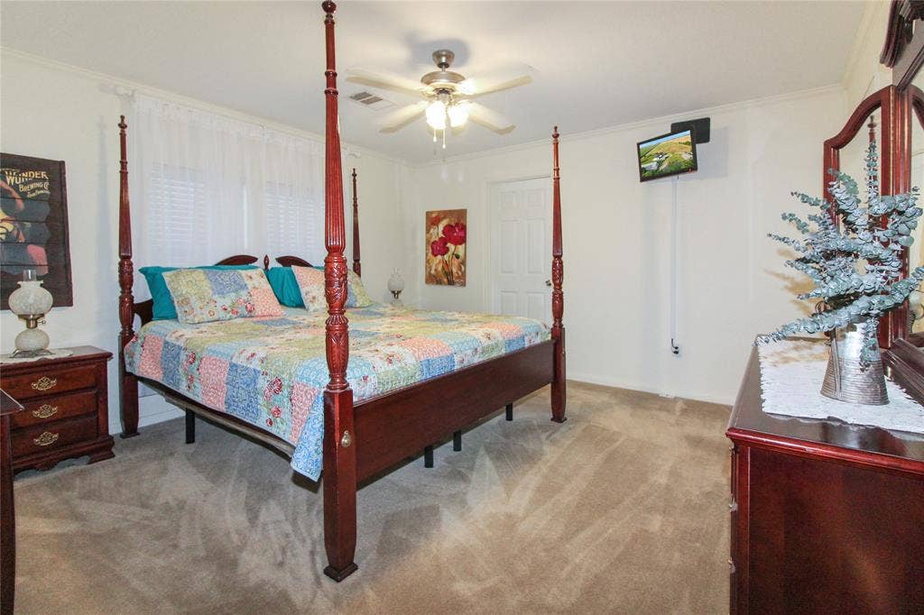 455 Hughes Cemetery Road, Italy, TX 76651 Carpeted room featuring crown molding and a ceiling fan