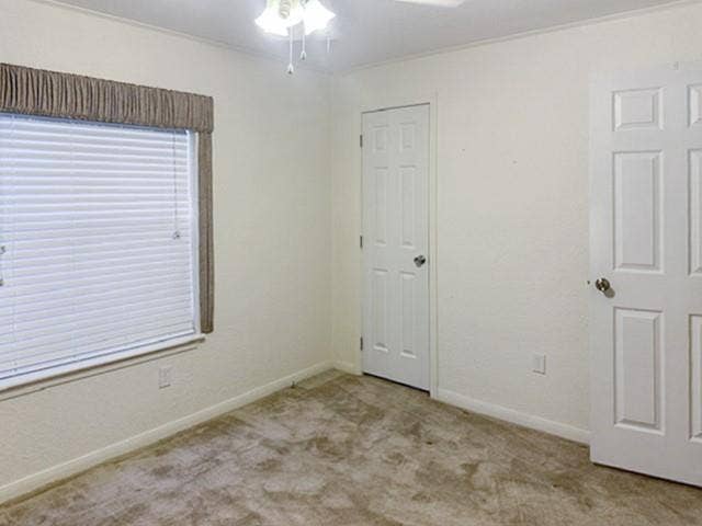 455 Hughes Cemetery Road, Italy, TX 76651 Neutral-toned carpeting and light-colored walls create a versatile interior