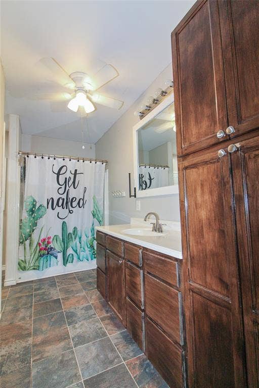 455 Hughes Cemetery Road, Italy, TX 76651 1936 HOUSE Bathroom vanity with wood-finish cabinetry, white countertop, and integrated sink