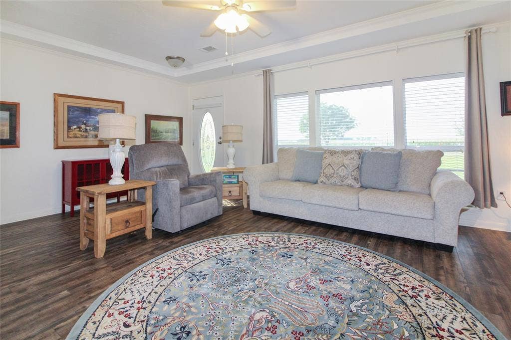 455 Hughes Cemetery Road, Italy, TX 76651 Spacious interior featuring wood-finish flooring, white walls, and crown molding