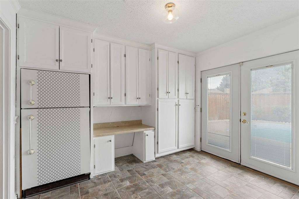 2708 Downing Drive, Plano, TX 75023 Mud room workspace with extra refrigerator.