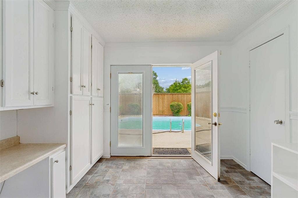 2708 Downing Drive, Plano, TX 75023 Mud room workspace with extra refrigerator.