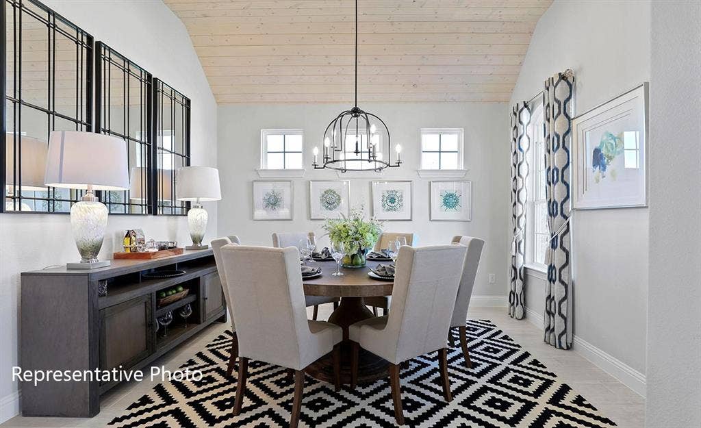 1140 Beaumont Lane, Red Oak, TX 75154 Vaulted wood-finish ceiling above a dining area featuring a dark wood-finish round table and upholstered chairs