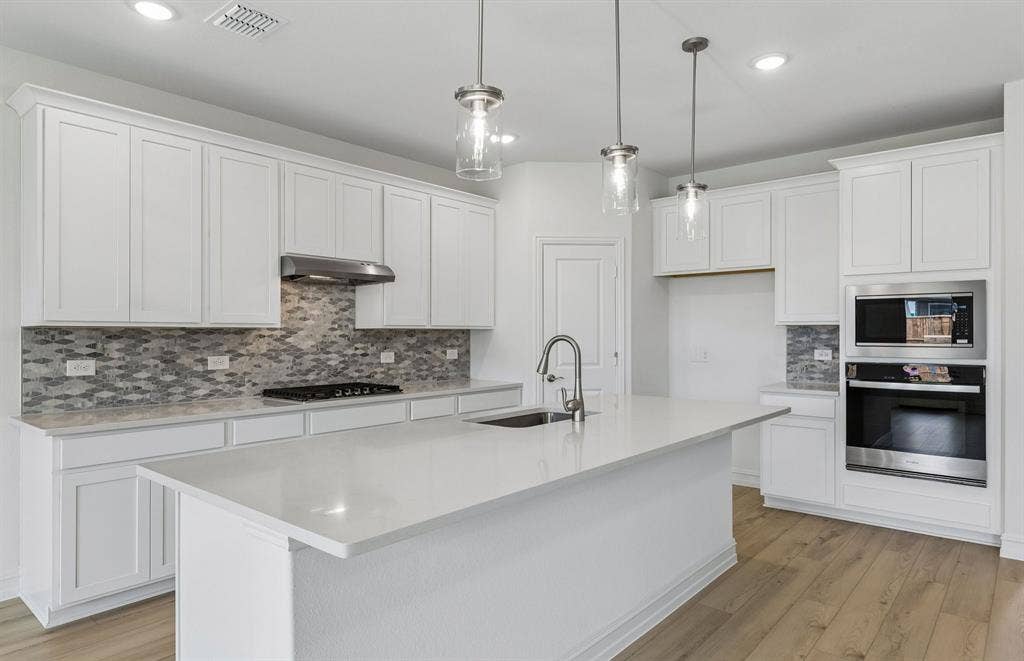 1604 Cydney Lane, Anna, TX 75409 Eat-in bartop island in kitchen