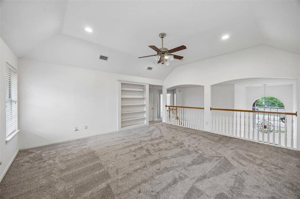 2701 Oates Drive, Plano, TX 75093 Spacious upper-level room featuring vaulted ceilings and recessed lighting