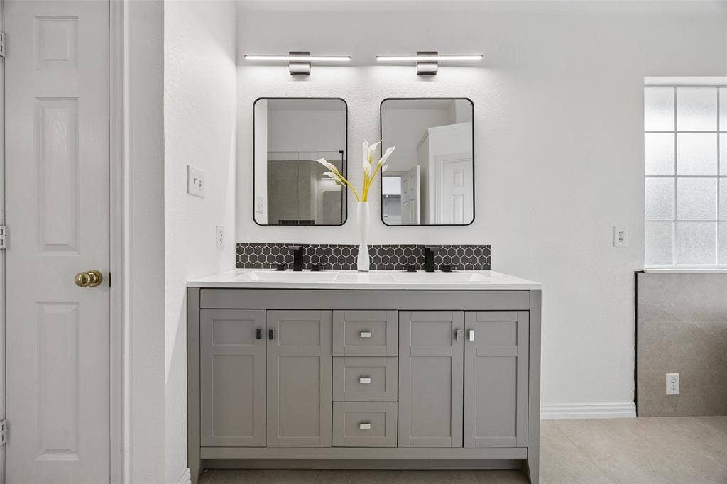 2701 Oates Drive, Plano, TX 75093 Dual vanity with a white countertop and undermount sinks