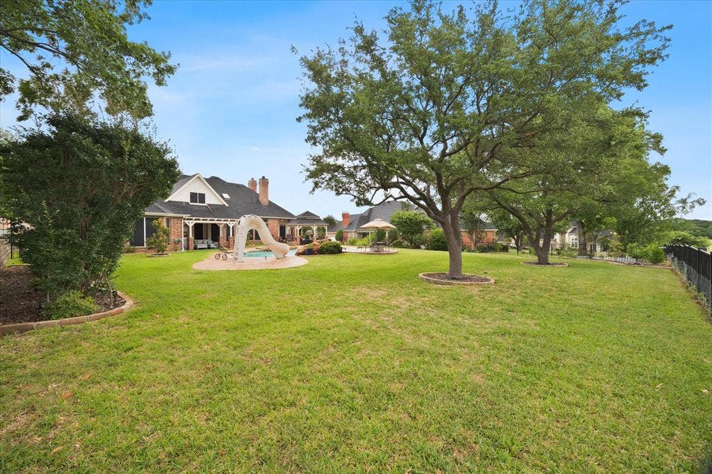 621 Liechty Court, Heath, TX 75032 Expansive fenced backyard provides plenty of space to run and play!